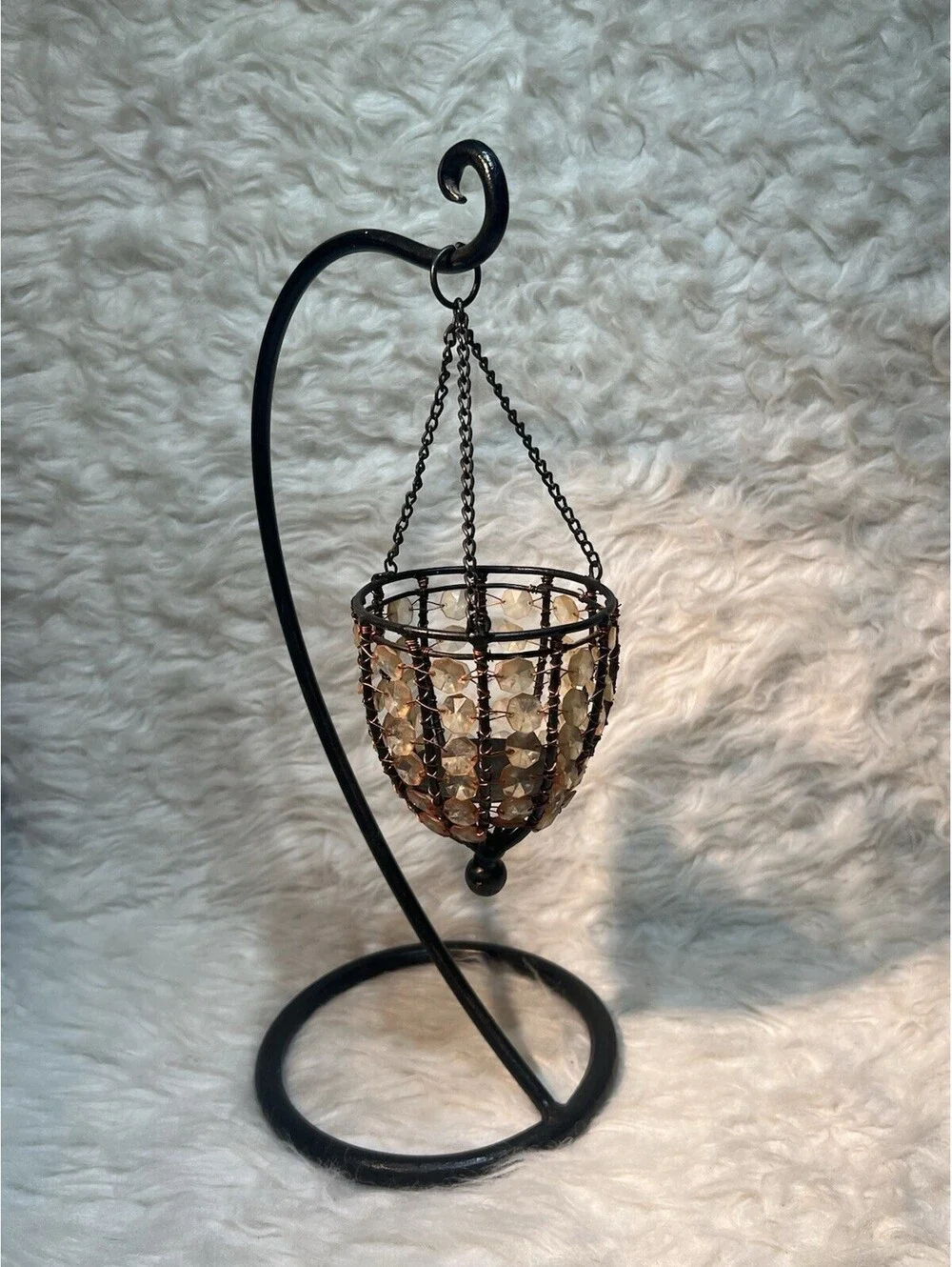 Glass beaded chandelier votive candle holder hanging on black metal Stand